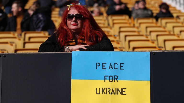 A fan shows her support for Ukraine in Molino